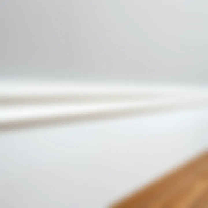 Close-up of white skirting board highlighting texture
