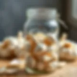 Glass jar filled with fresh garlic cloves