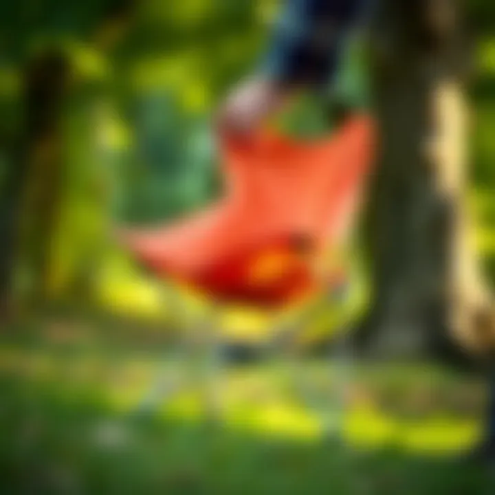 A foldable camping chair being easily carried in one hand